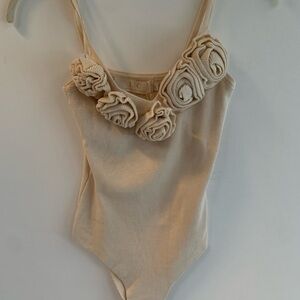 Elegant Cream Bodysuit with Floral Details